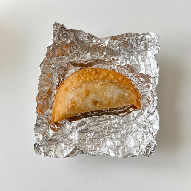 Pernil & Cheese Empanada.